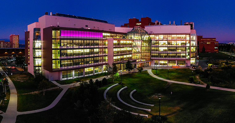 The Integrated Sciences Complex, lit up at night