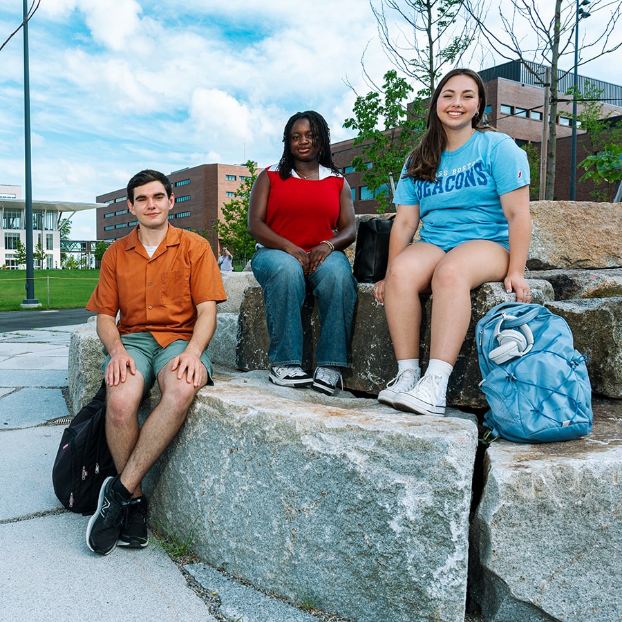 quad students sitting on cinder blocks in quad