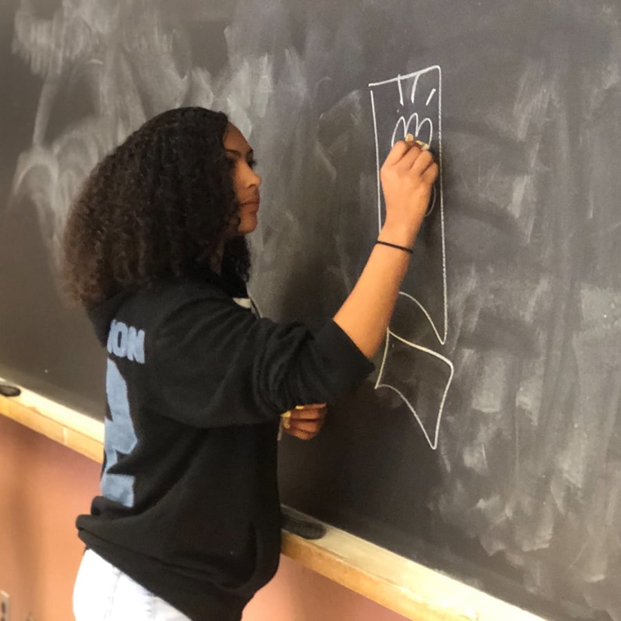 Black female student at blackboard