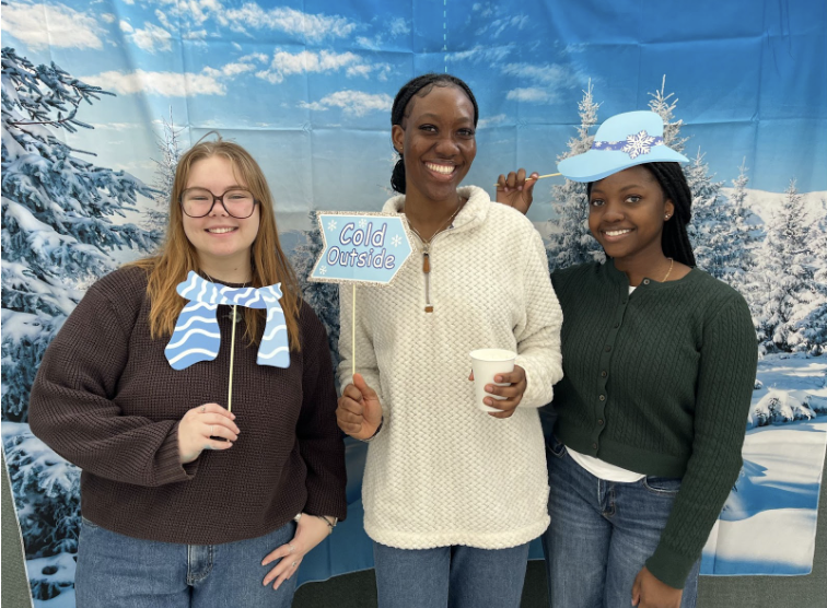 Honors Ambassadors holding winter displays