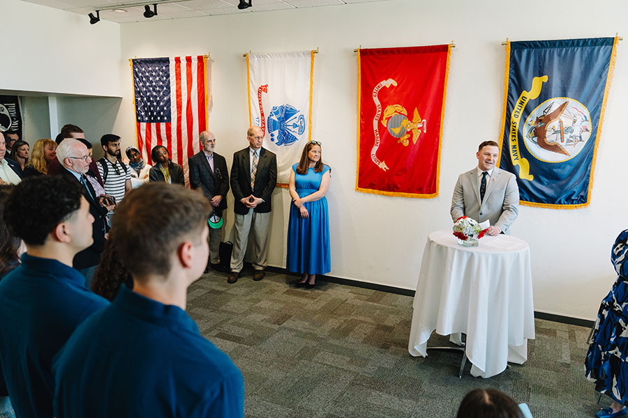 Troy Hewitt speaks at the ribbon cutting.