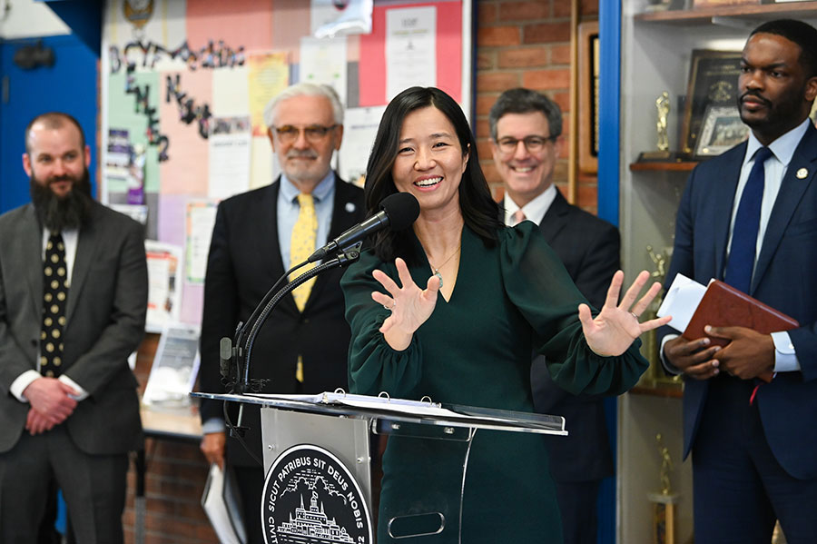 Mayor Wu speaks as Chancellor Marcelo Suárez-Orozco and city officials look on.